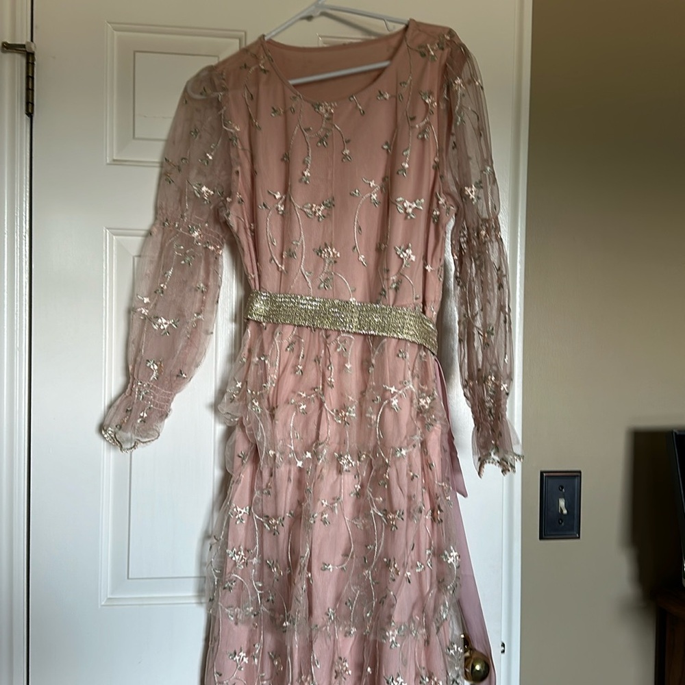 Brand new dress never been worn fits a little big